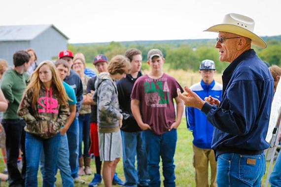 MU Extension staff member talking with group of rural kids